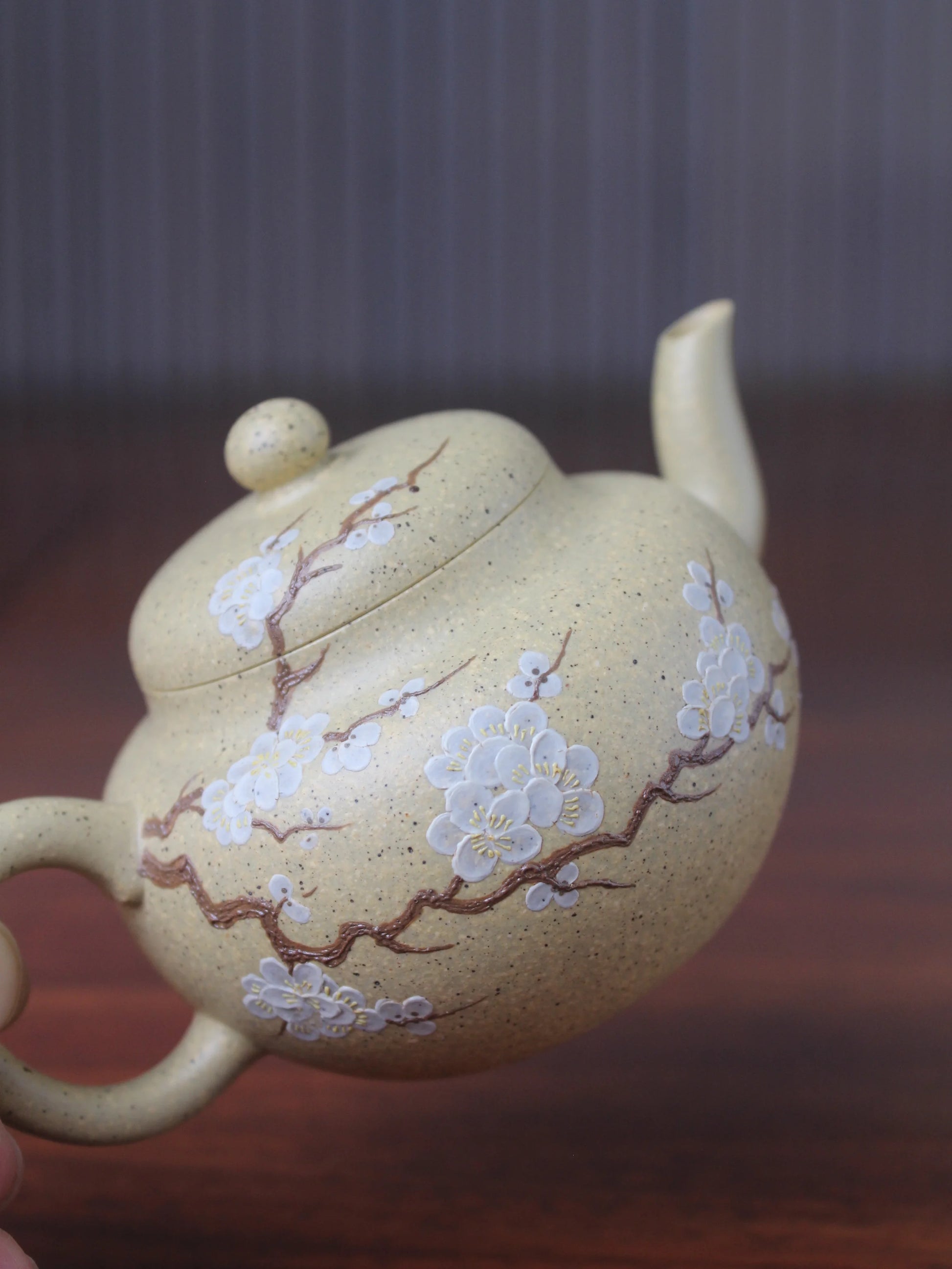 the detail of the bloom panting on the teapot