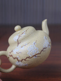 the detail of the bloom panting on the teapot