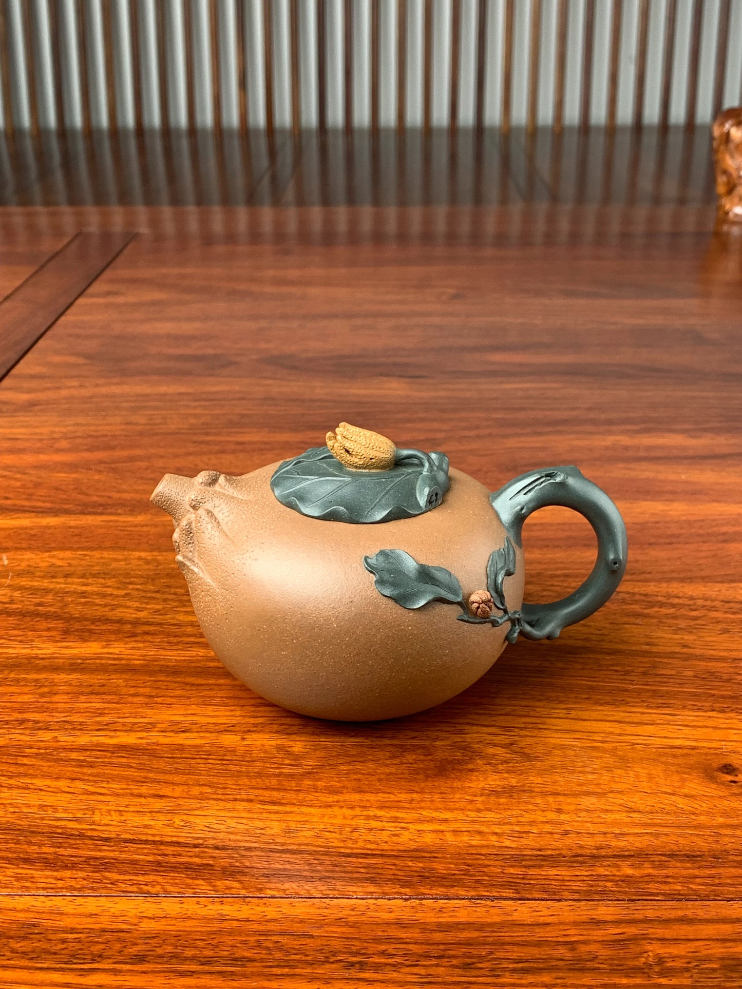the artistic teapot on the table front view