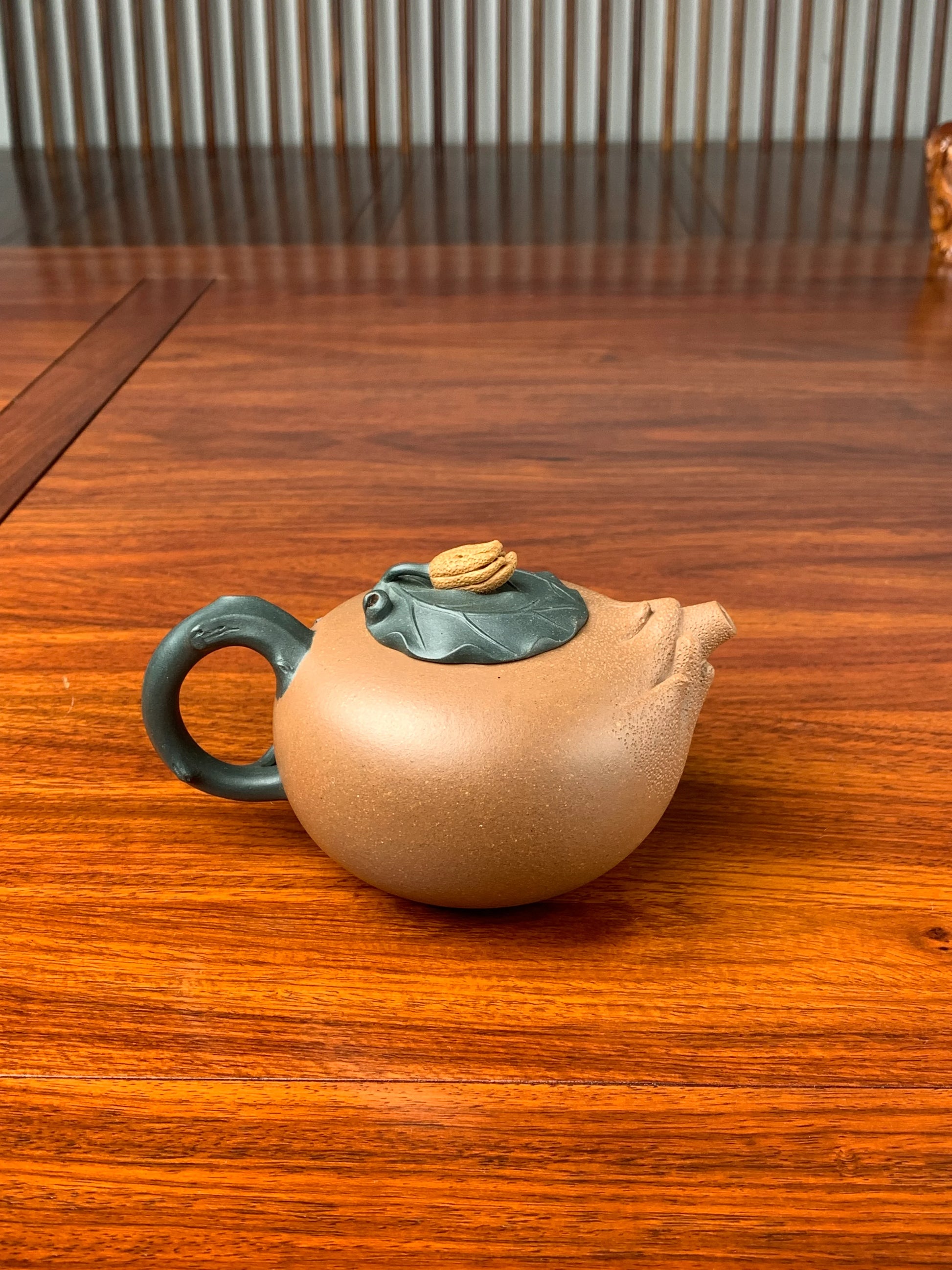 the artistic teapot on the table back view