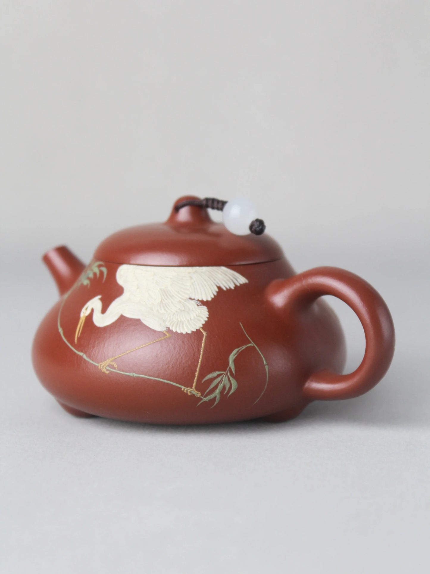The left view of the artwork teapot named "Egret,"