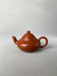 authentic yixing teapot named li xing on the table