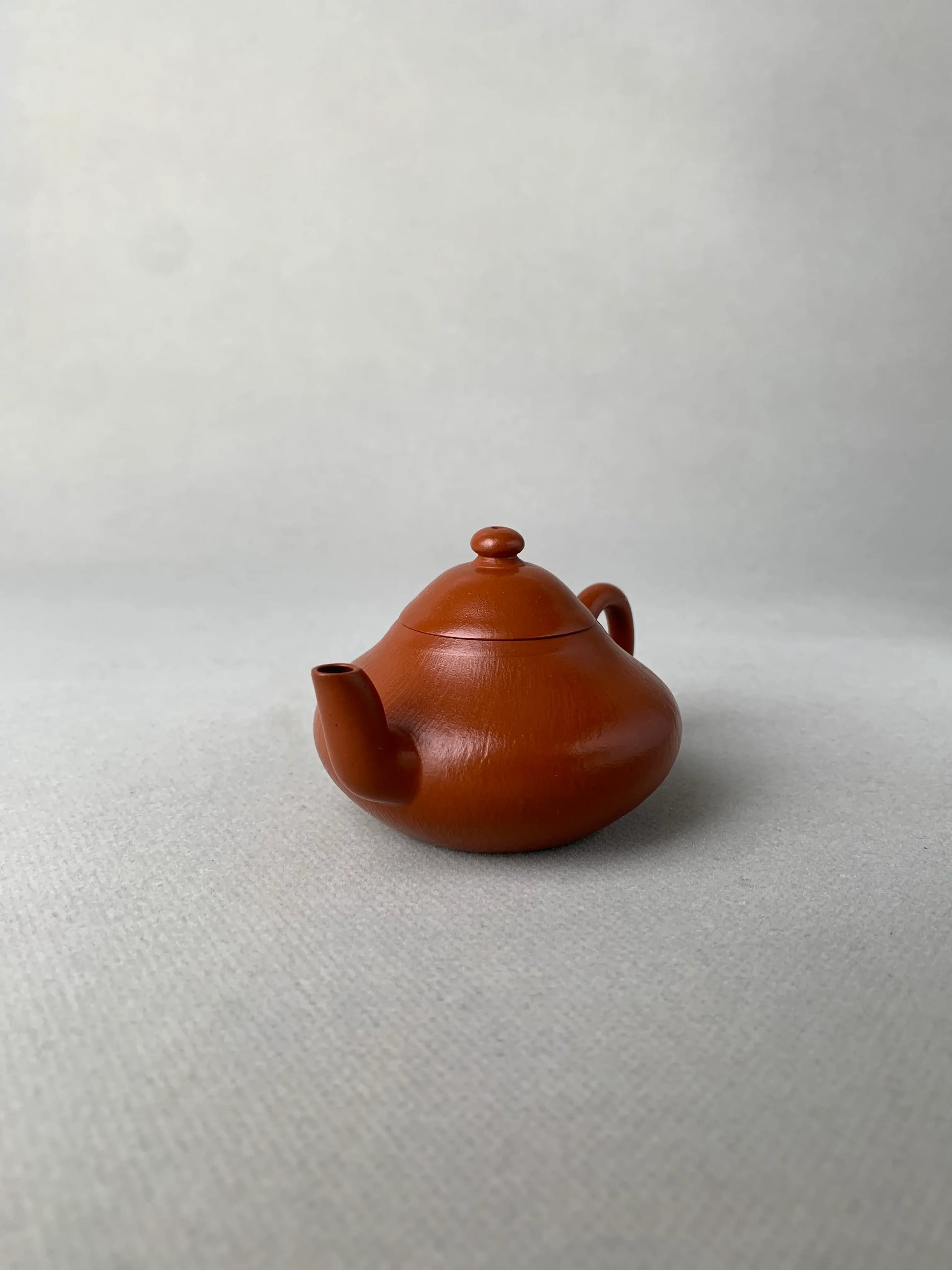 right view of authentic yixing teapot named li xing on the table