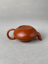 Turn the teapot over and take a closer look at the bottom details
