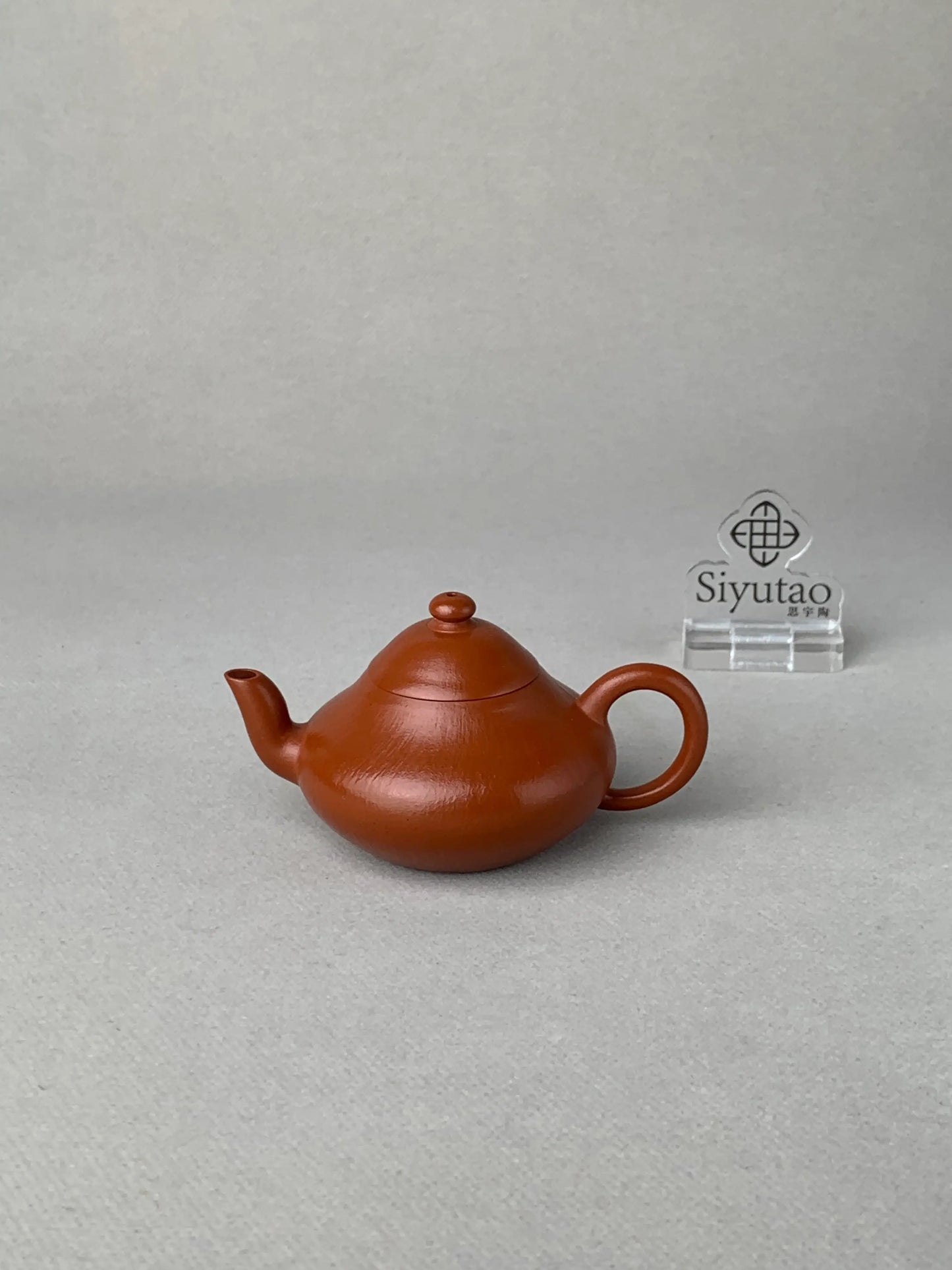 Front view of the authentic Yixing teapot on the table