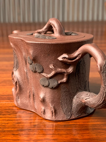 Look closely at the pine-tree motif decorating the handle of this beautiful teapot.