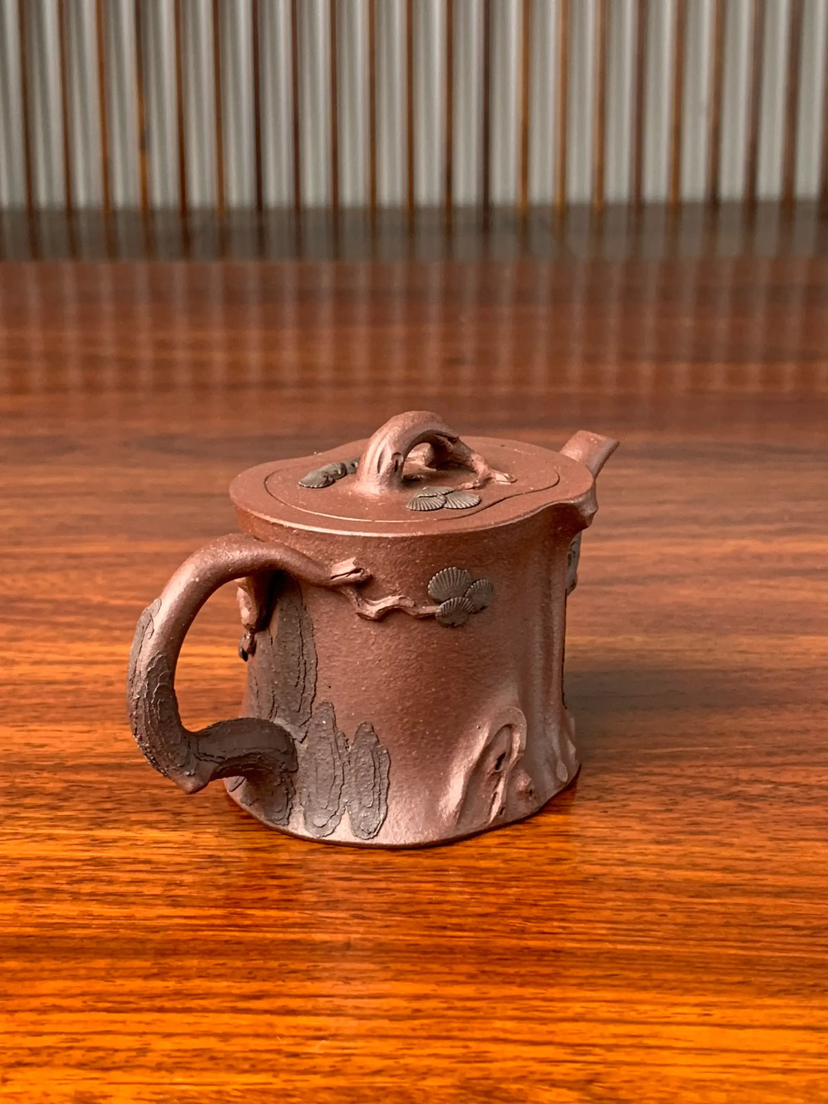 Look at the handle of this beautiful teapot from the right side