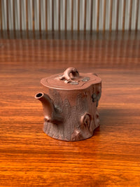 left side view of this beautiful teapot named “Pine Tree.”