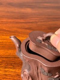the lid and the mouth of the beautiful teapot named pine tree