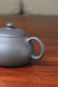 handle of chinese teapot xishi on the table