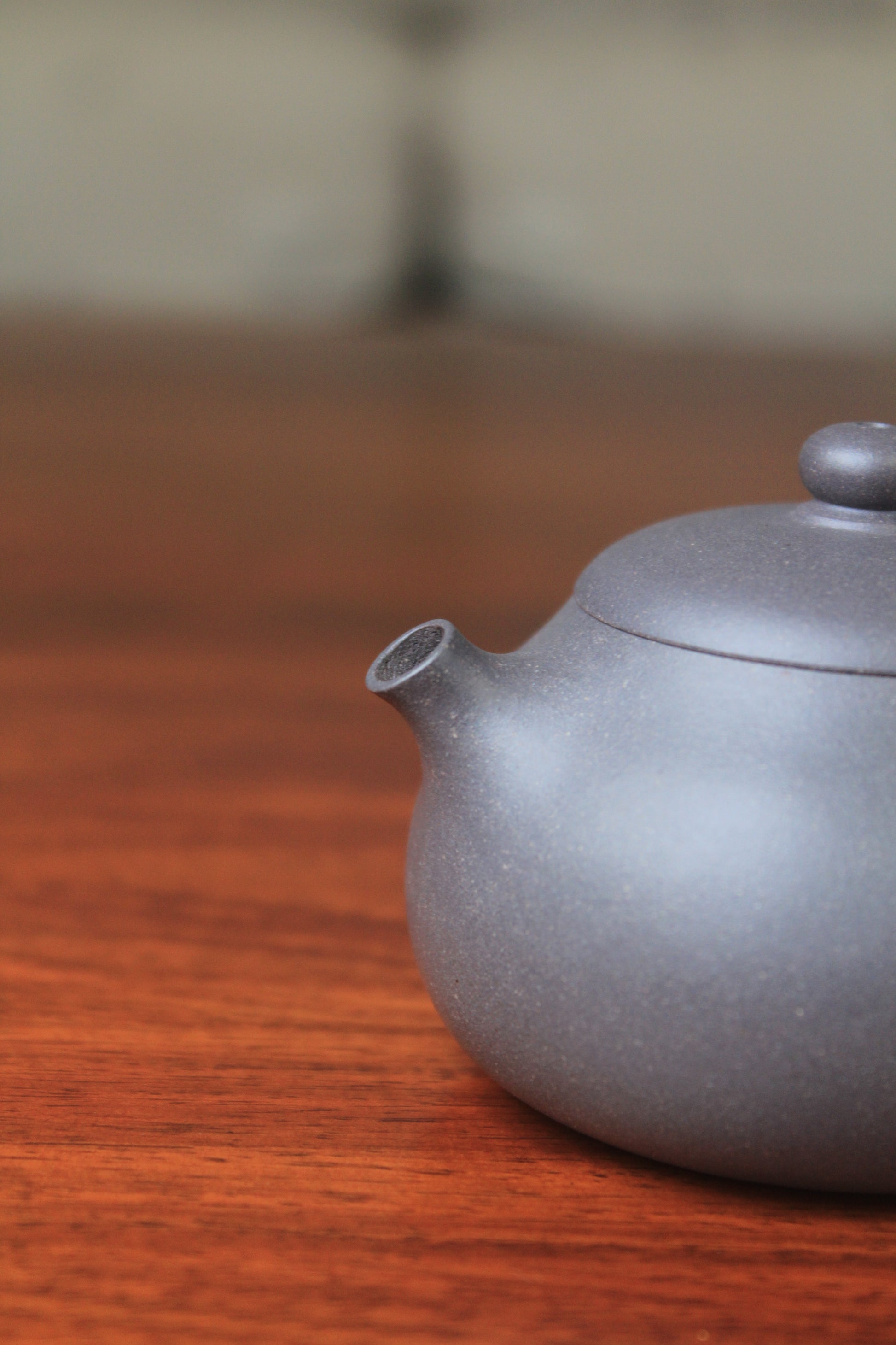 spout detail of chinese teapot xishi on the table