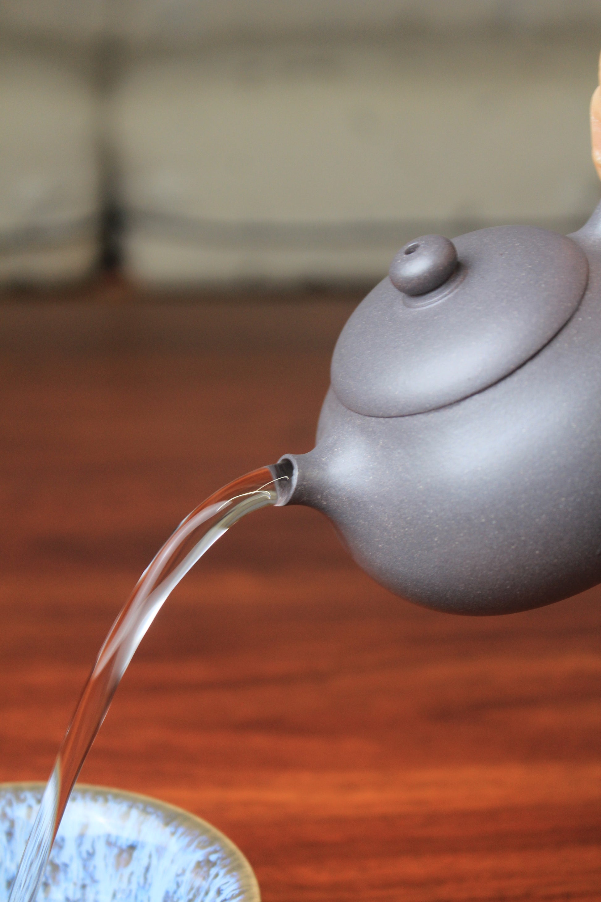 pour of chinese teapot xishi on the table
