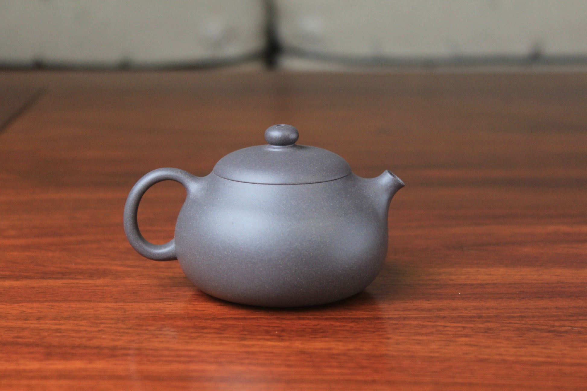 Back detail of chinese teapot xishi on the table