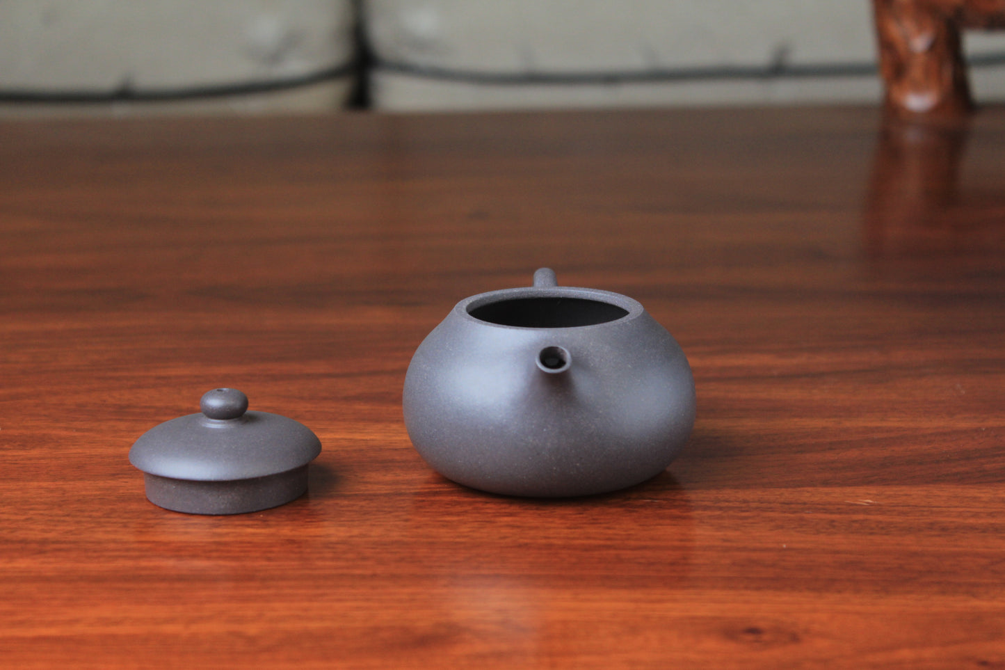 Spout and lid of chinese teapot xishi on the table