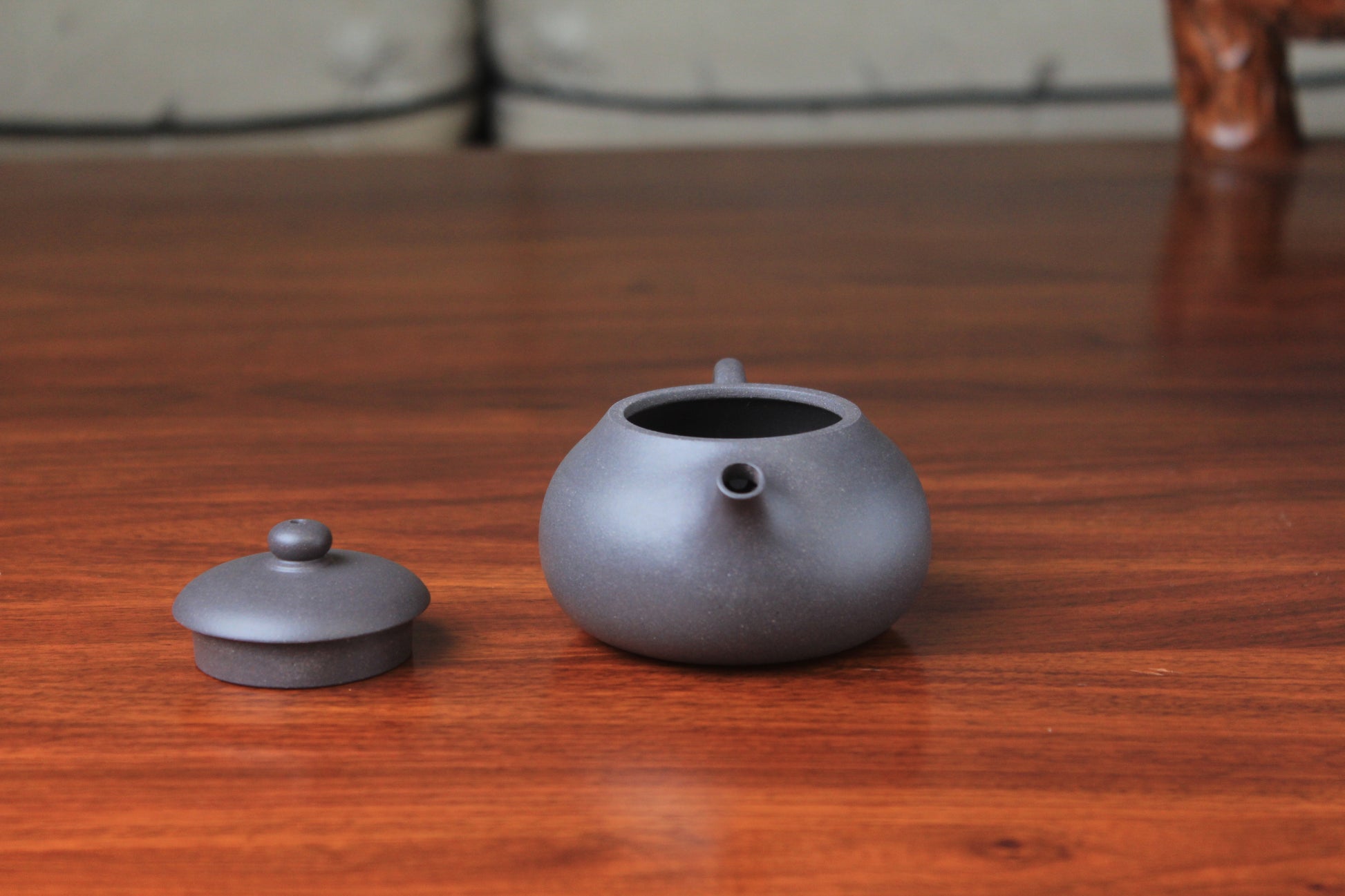 Spout and lid of chinese teapot xishi on the table
