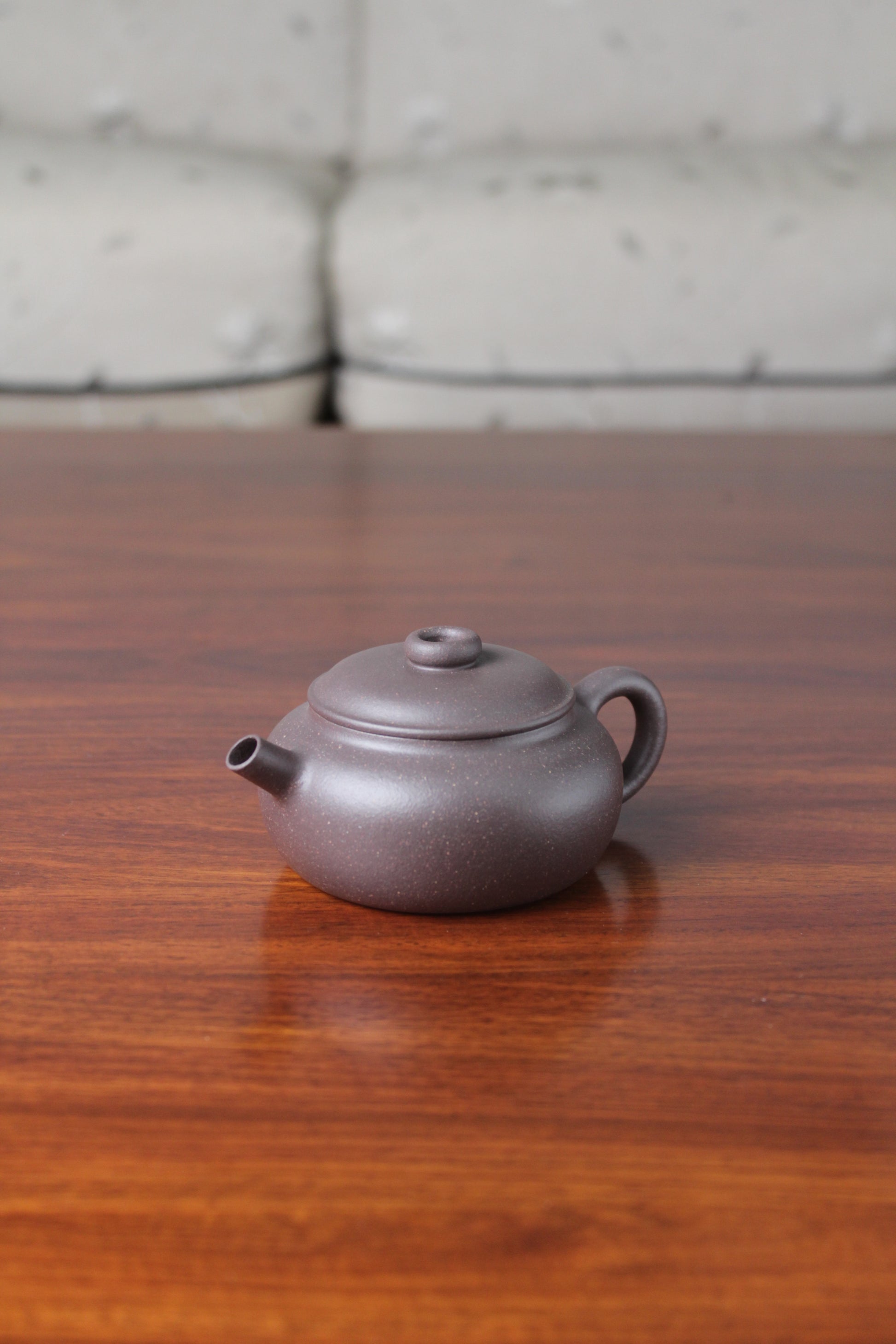 Right view of the Chinese teapot on the table