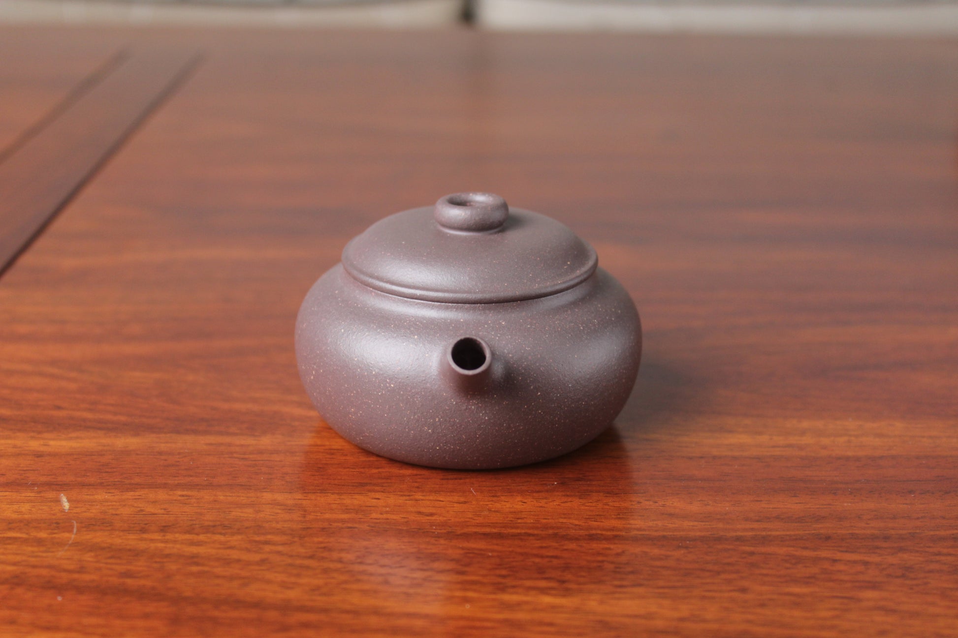 Front view of Chinese teapot on the table