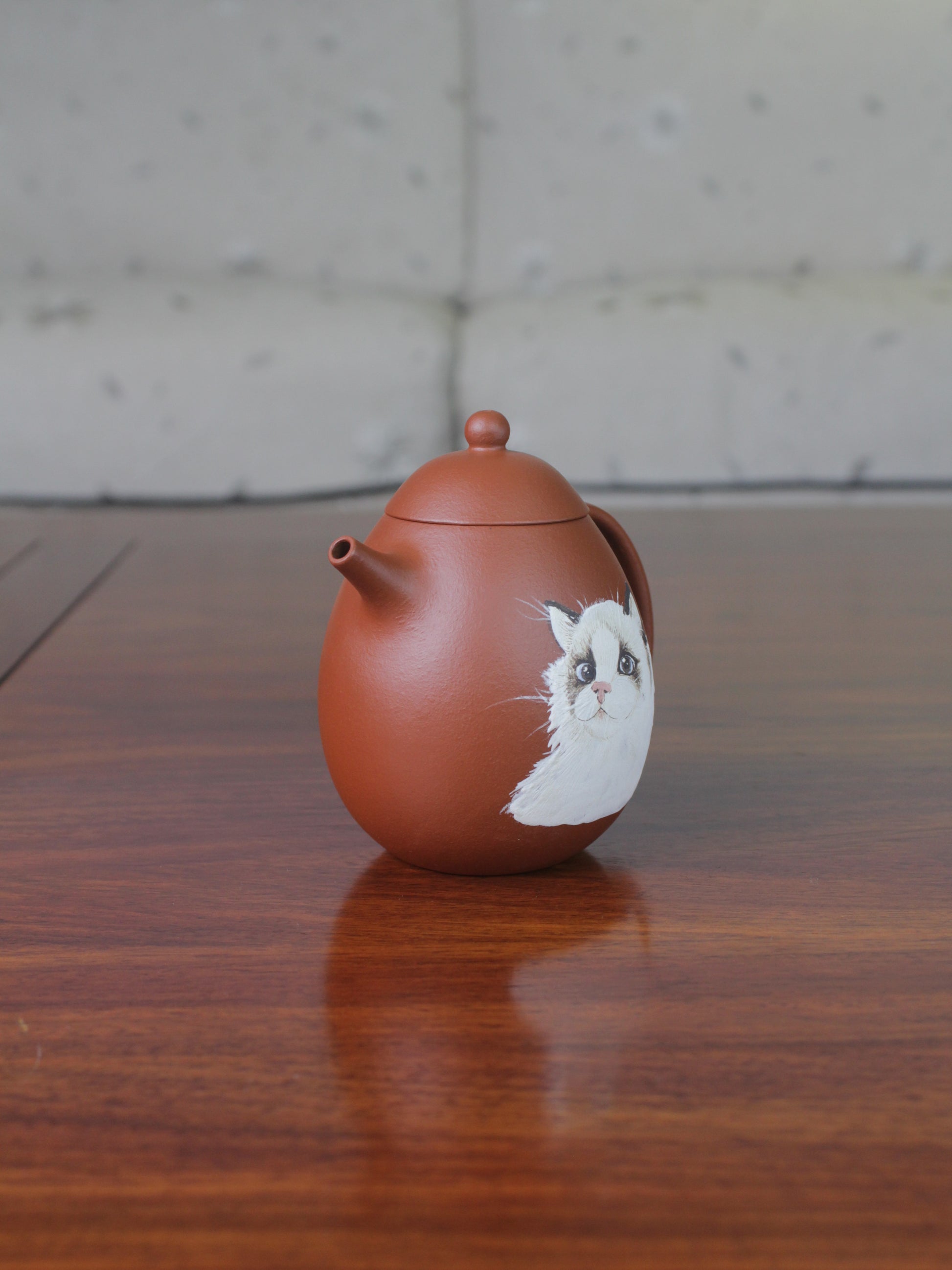 Right view of the chinese teapot. This yixing clay teapot was handmade with authentic purple clay zhu ni.