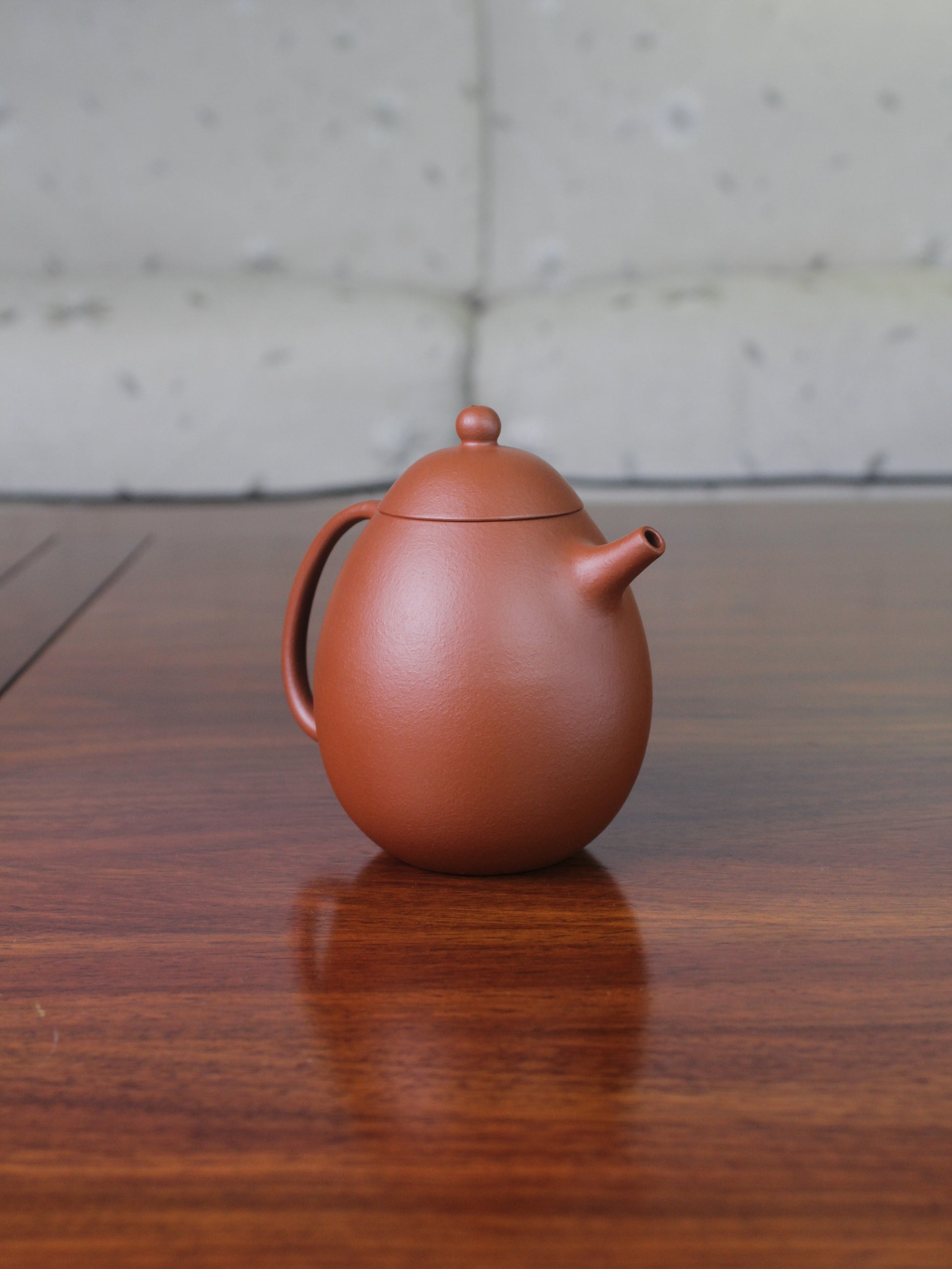 Back view of the chinese teapot. This yixing clay teapot was handmade with authentic purple clay zhu ni.