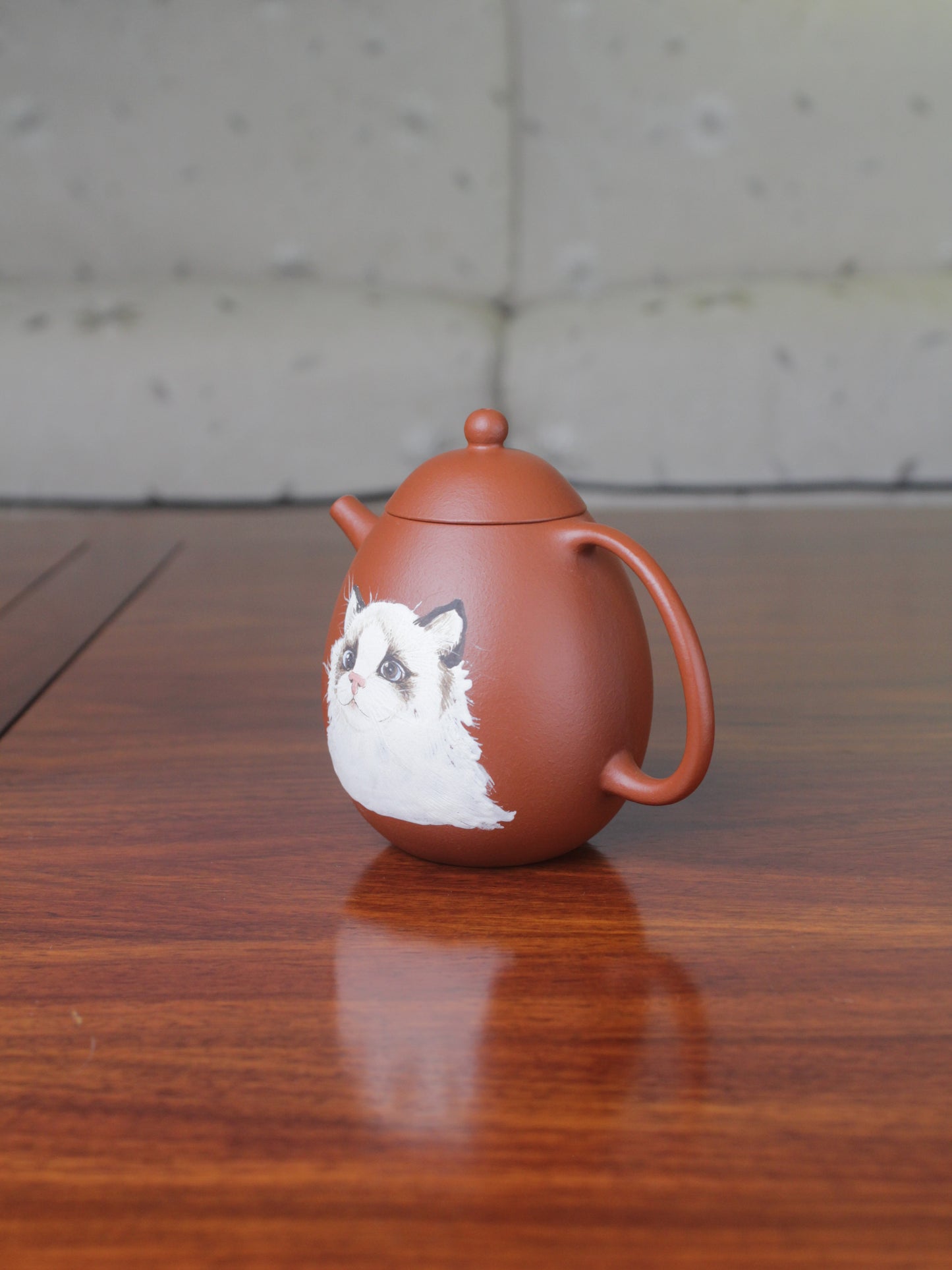 Side of the Chinese teapot. This yixing clay teapot was handmade with authentic purple clay zhu ni.