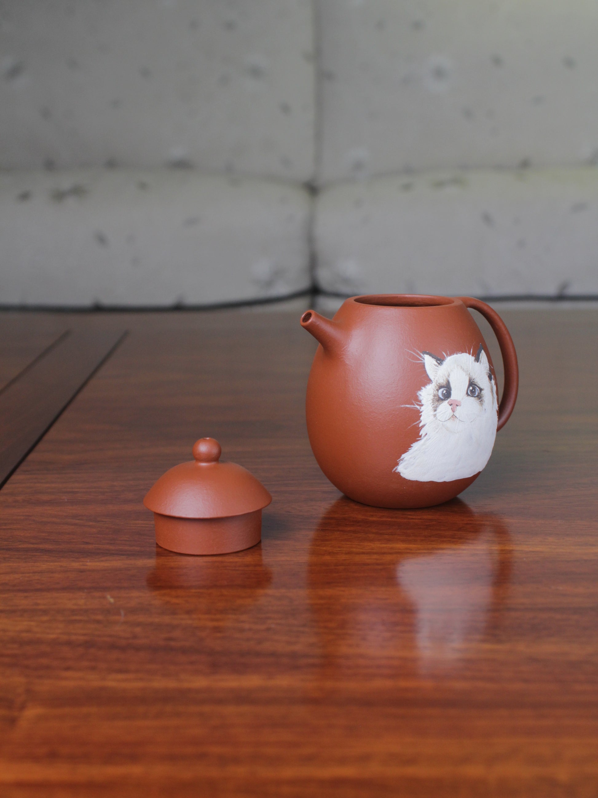 Detail of the Chinese teapot. This yixing clay teapot was handmade with authentic purple clay zhu ni.