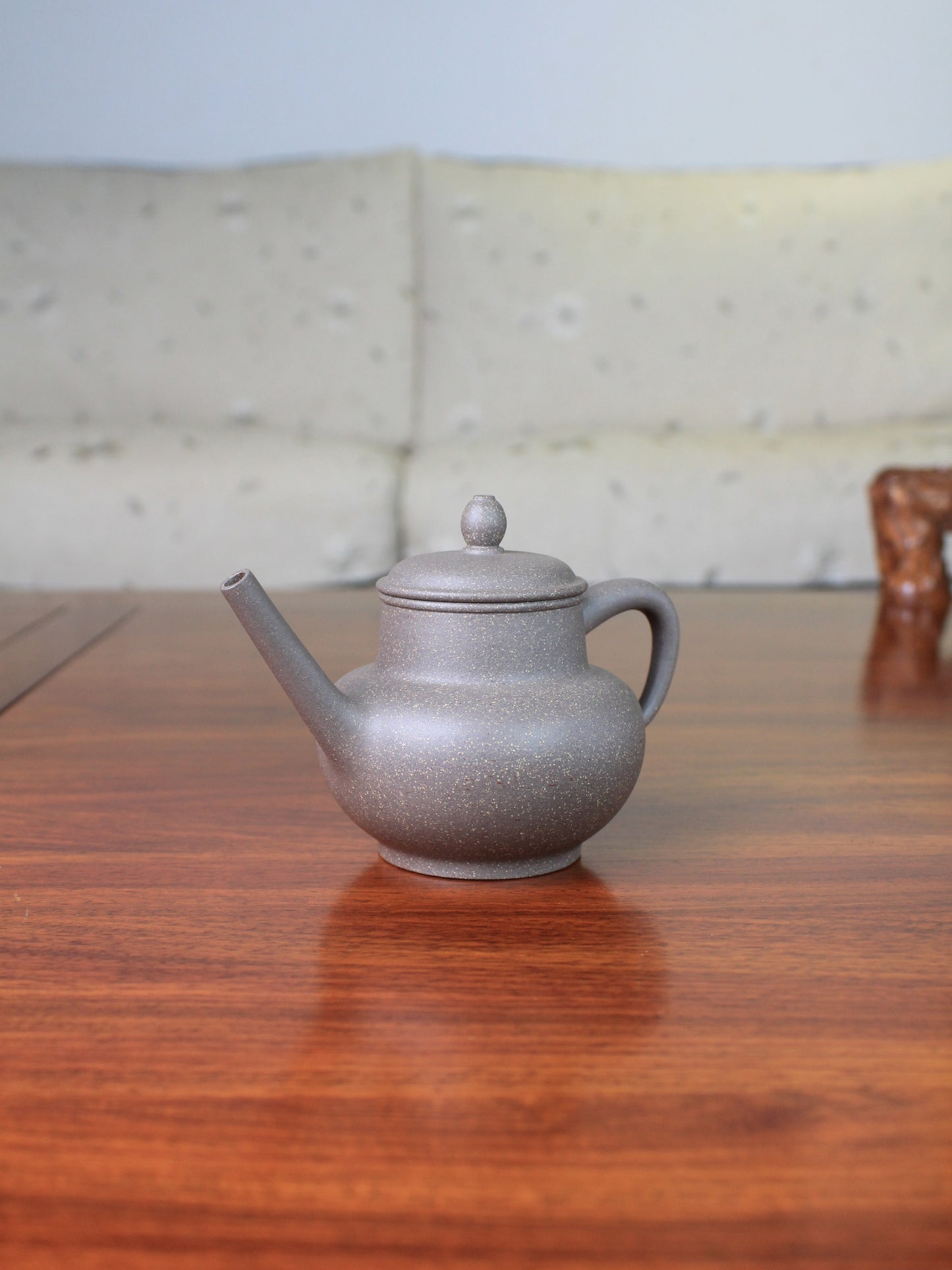 Right view of the Chinese teapot on the table