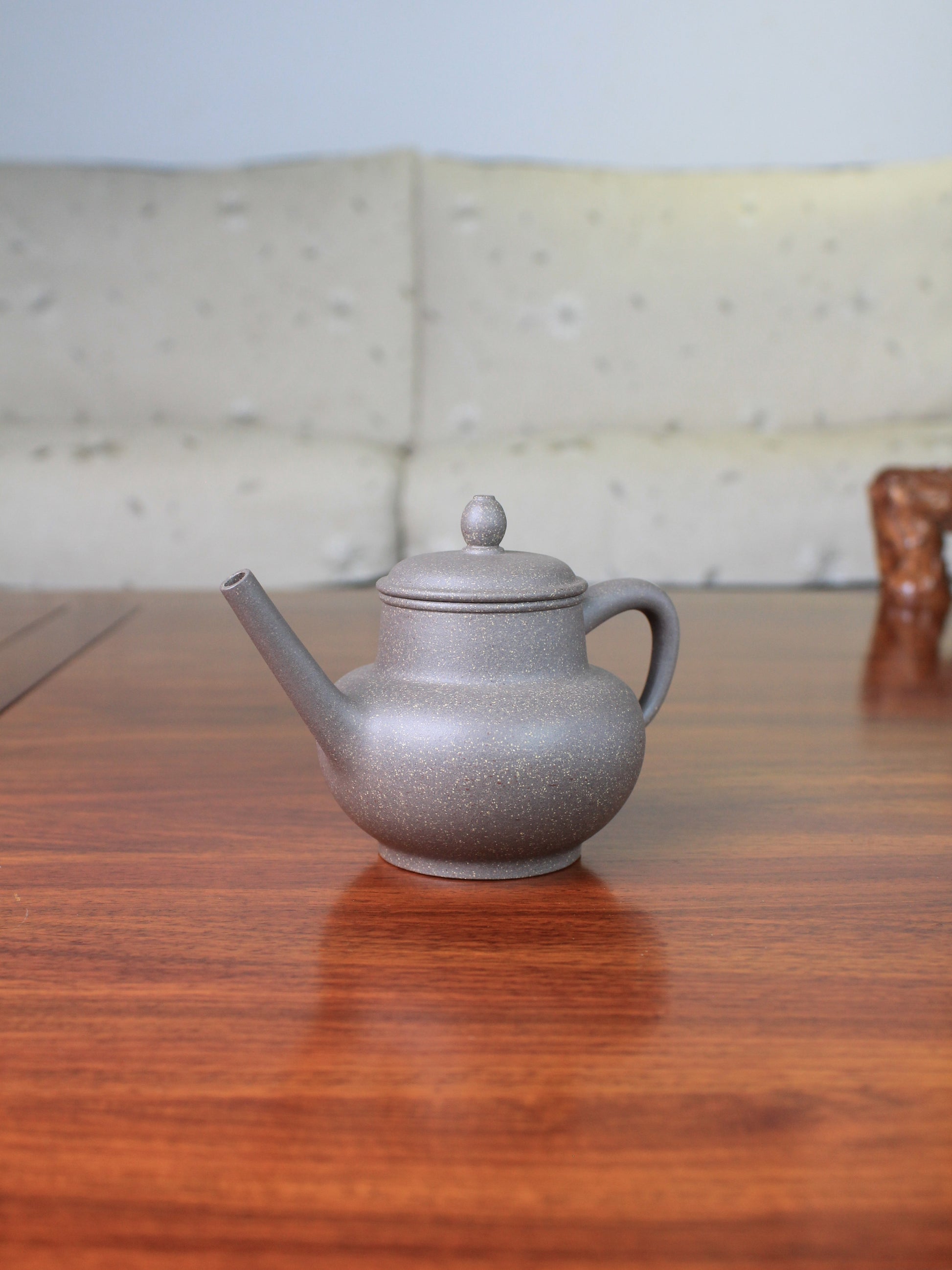 Right view of the Chinese teapot on the table