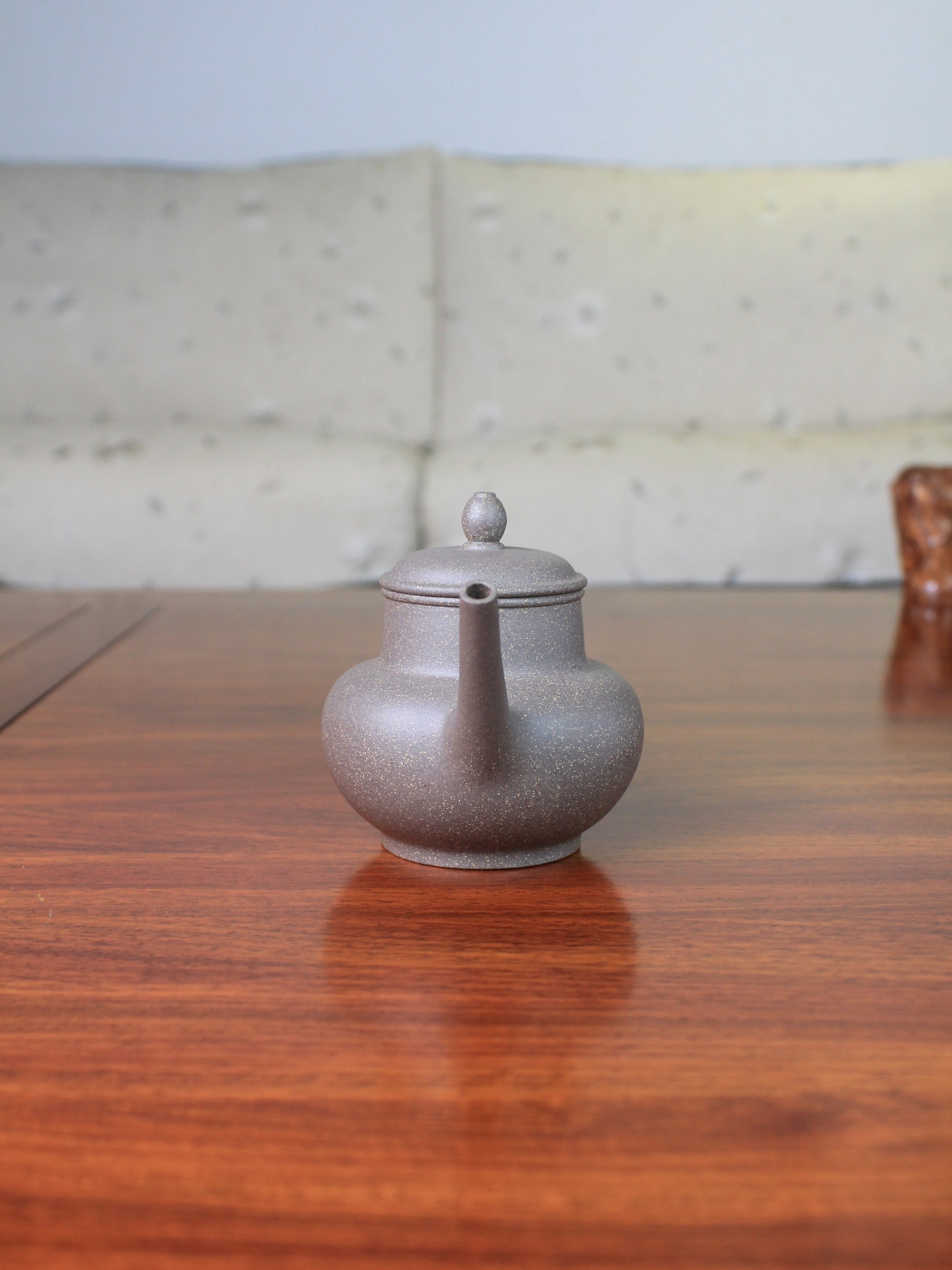 Front view of the Chinese teapot on the table