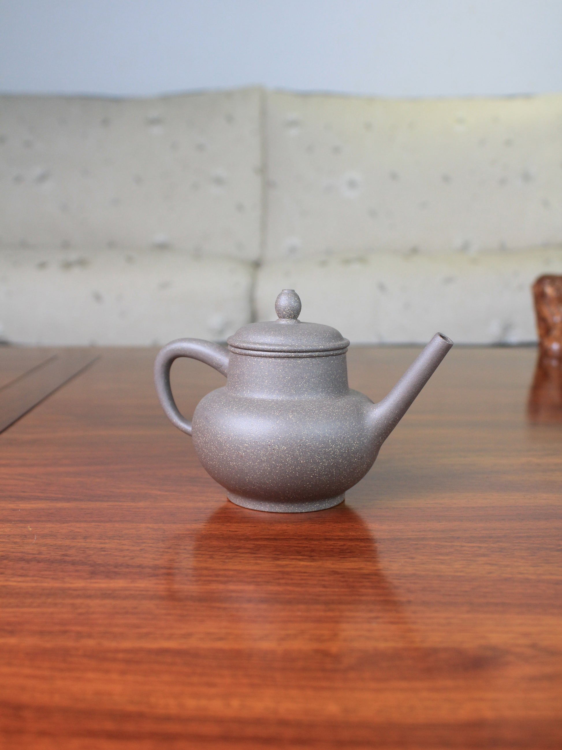 Back view of the chinese teapot on the table