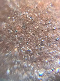 A macro photo of the teapot's aged lao zini clay