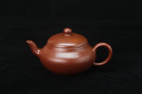 Front of Clay teapot handmade with purple clay from zisha art galley