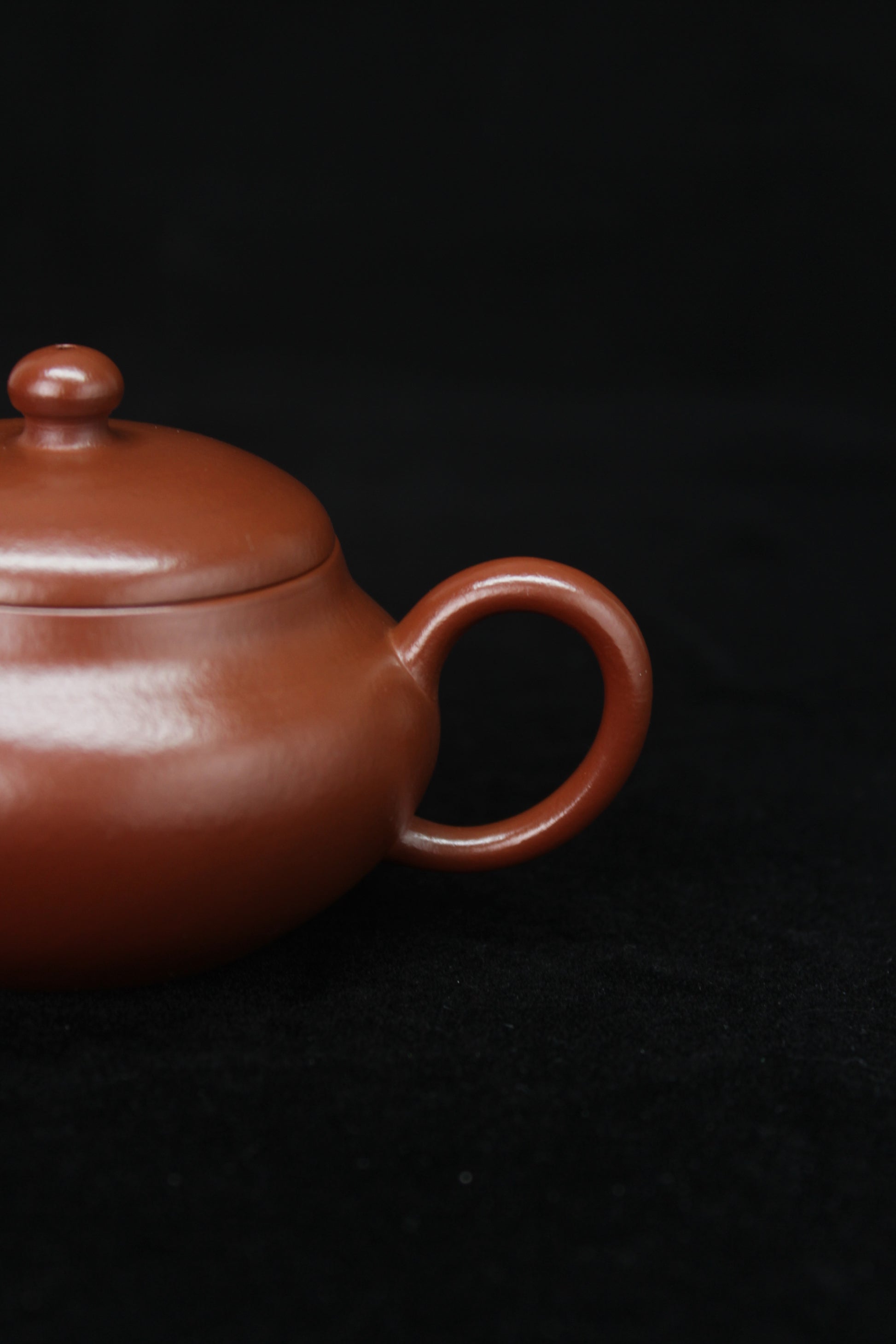 Handle details of Clay teapot handmade with purple clay from zisha art galley