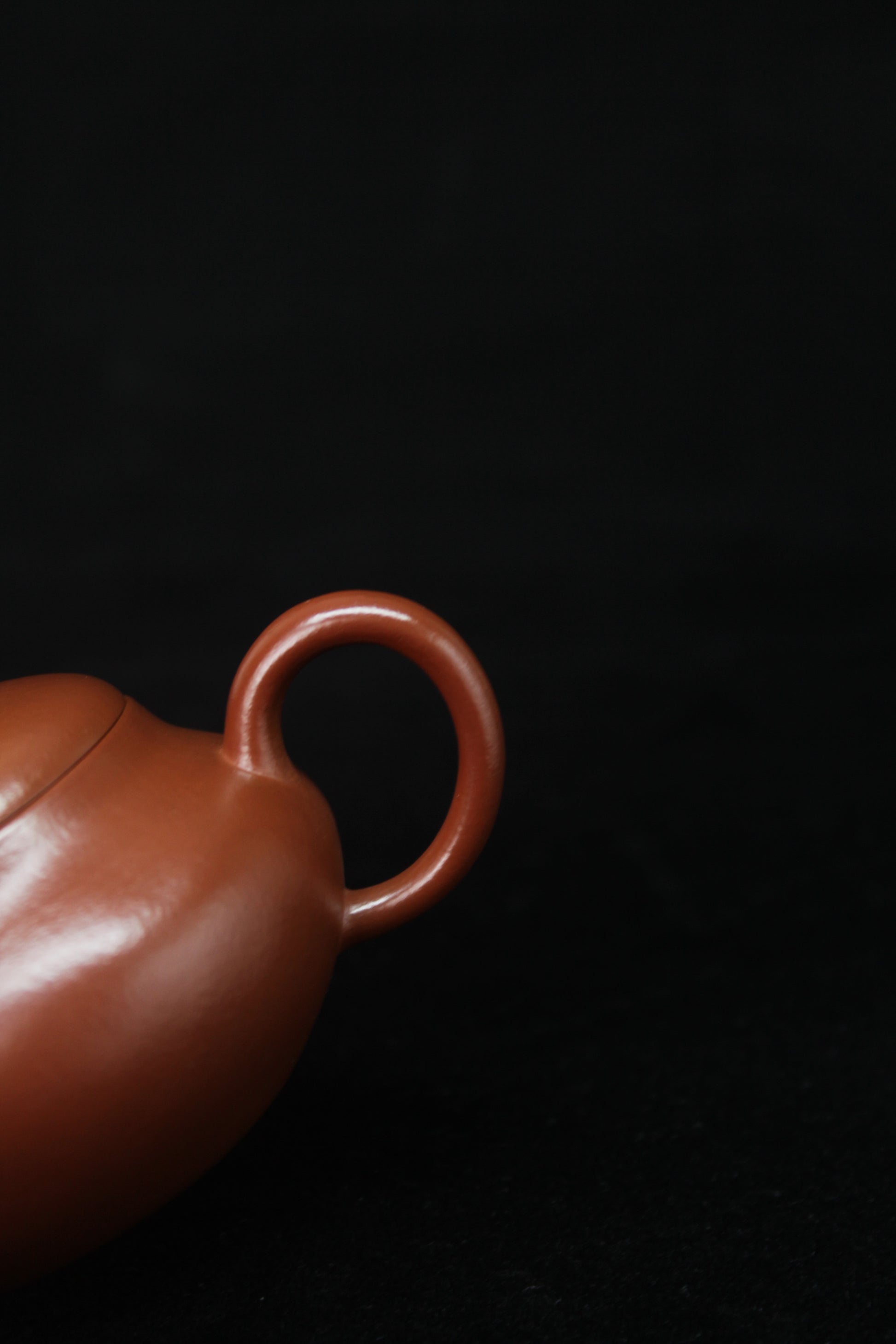 Handle detail of Clay teapot handmade with purple clay from zisha art galley