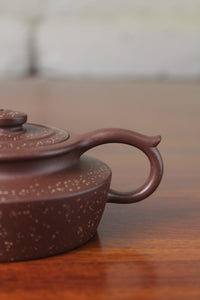 Handle detail of the collectible teapot handmade by teapot artist