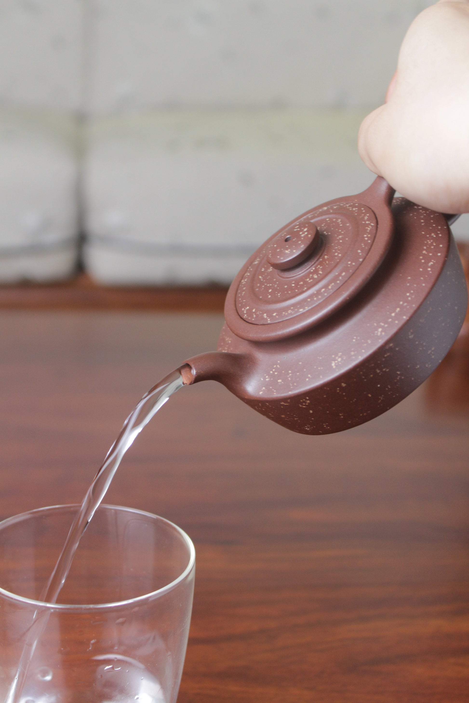 Pour of the collectible teapot handmade by teapot artist