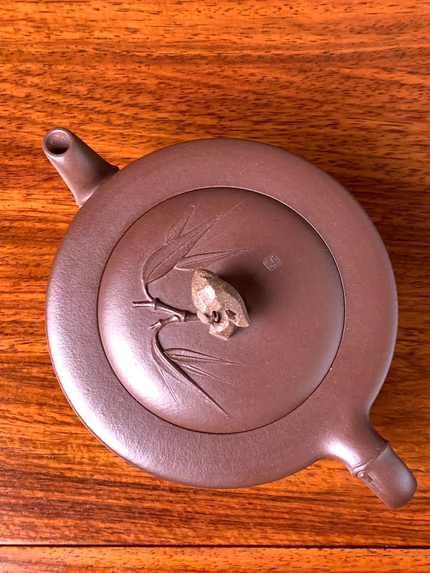 Overhead view of the teapot showing the handle, spout, lid, and knob