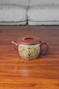Collectible teapot named han wa on the table
