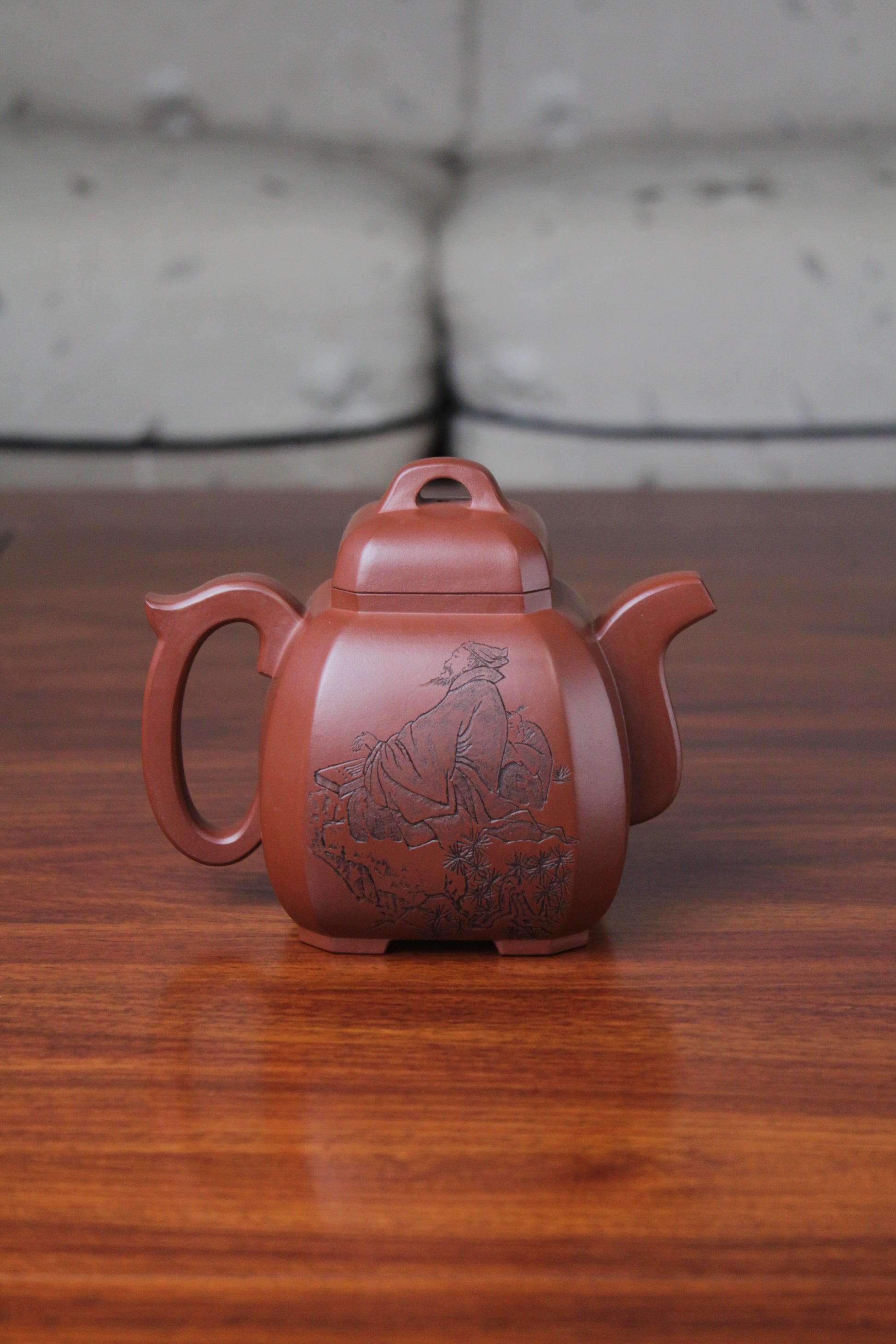 back of the collectible teapot from teapot artist on the table