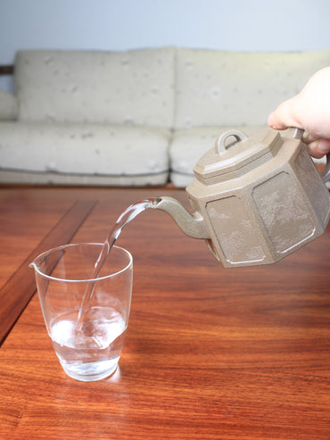 Pour of the collectible teapot named ba fang