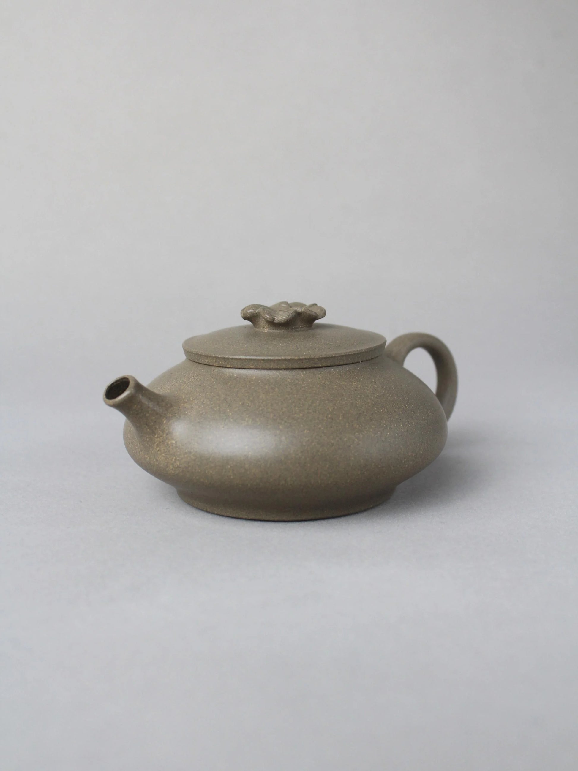collectble teapot named flower on the table - right view