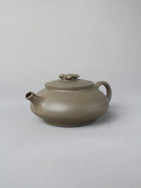 collectble teapot named flower on the table - right view