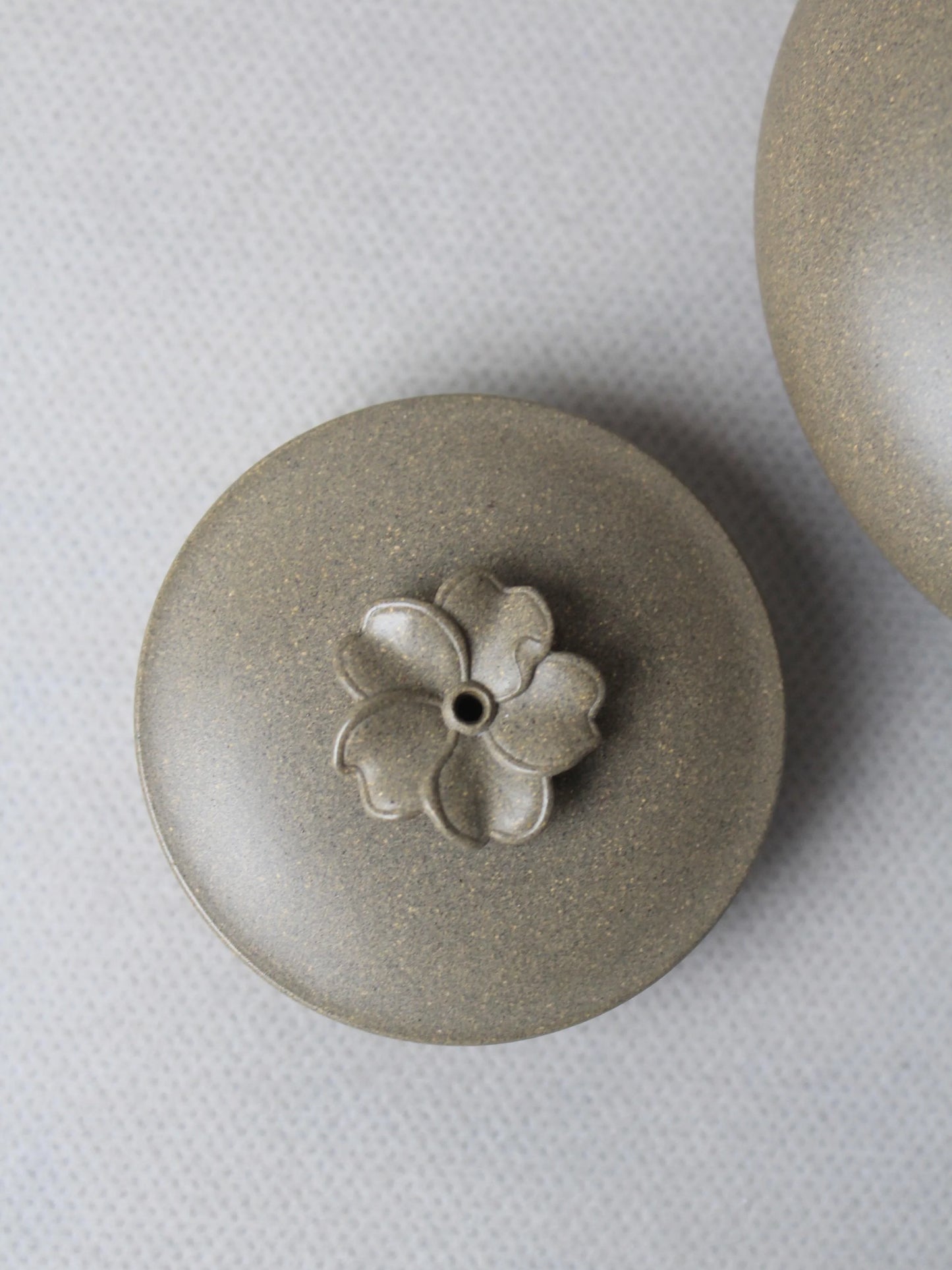 the lid of the collectible teapot on the table