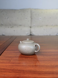 Right of the Collectible teapot named toad, handmade by teapot artist
