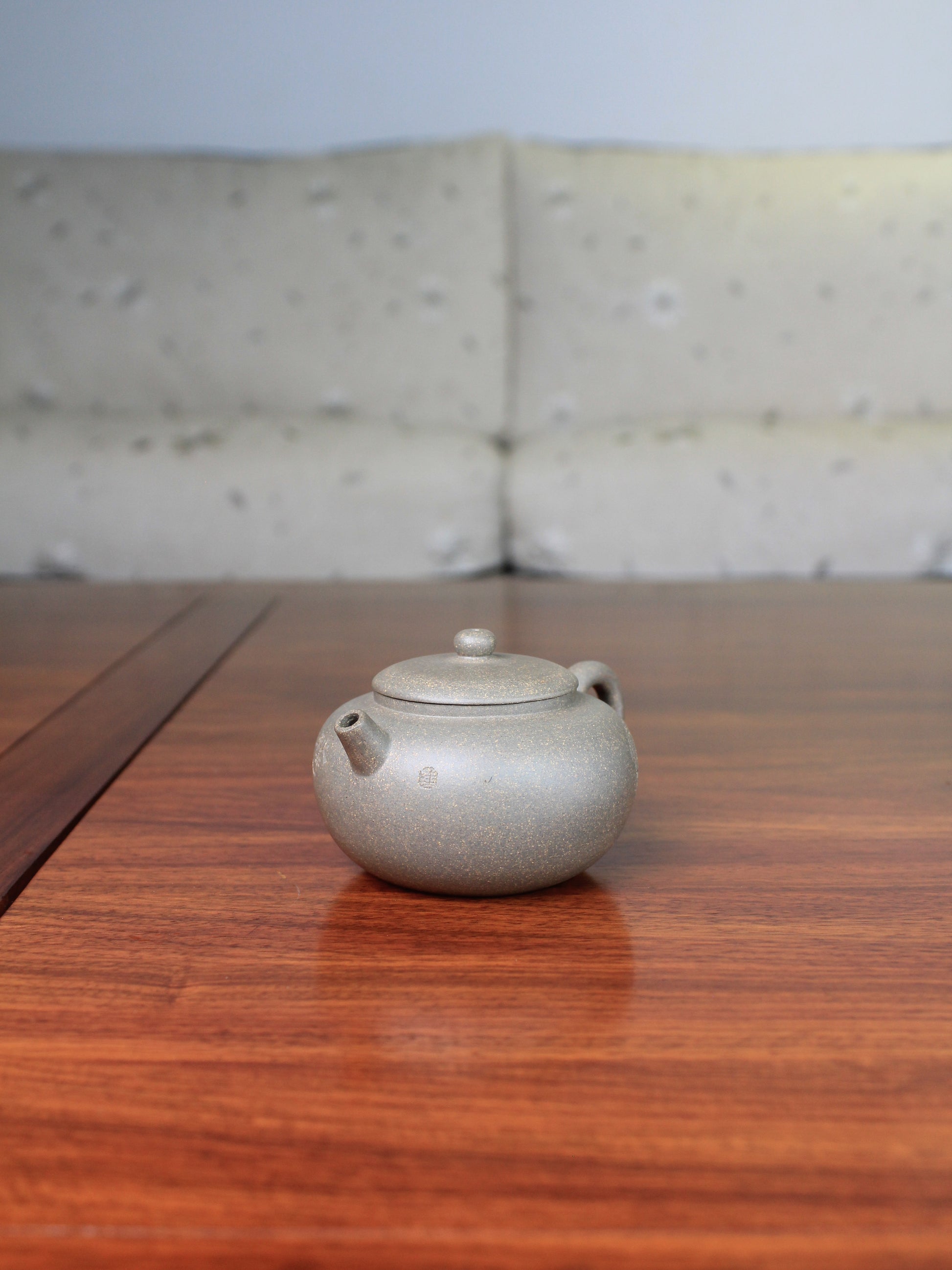 Left of the Collectible teapot named toad, handmade by teapot artist