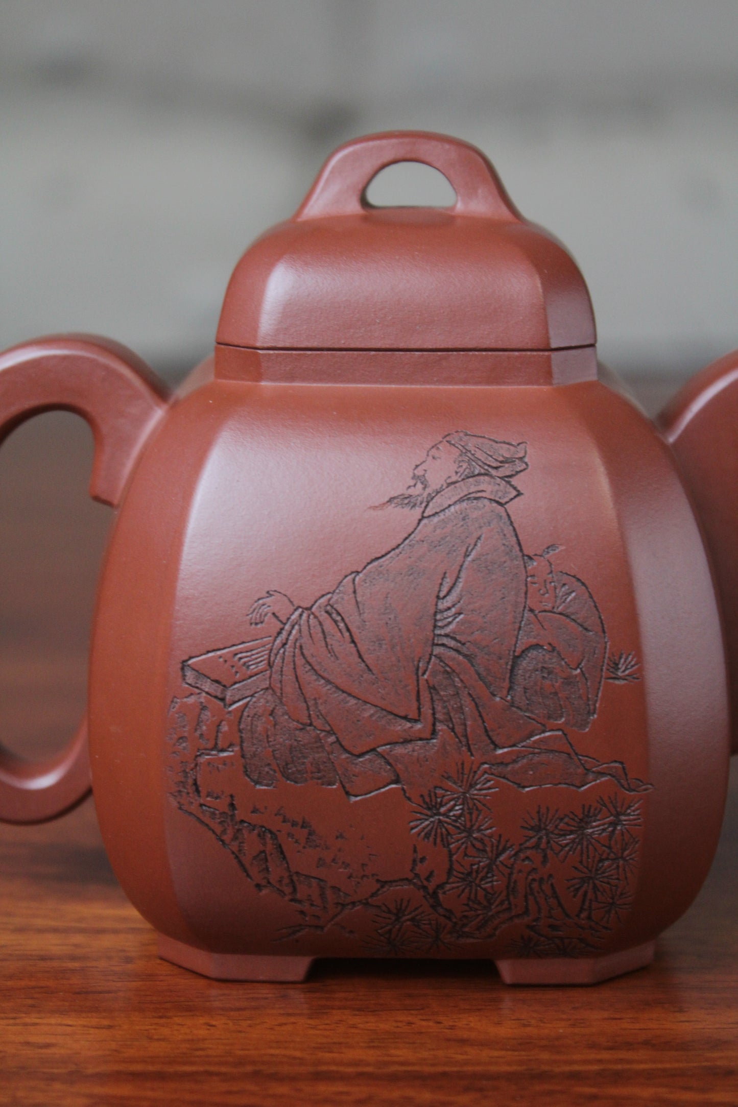 a pattern of the collectible teapot from teapot artist on the table