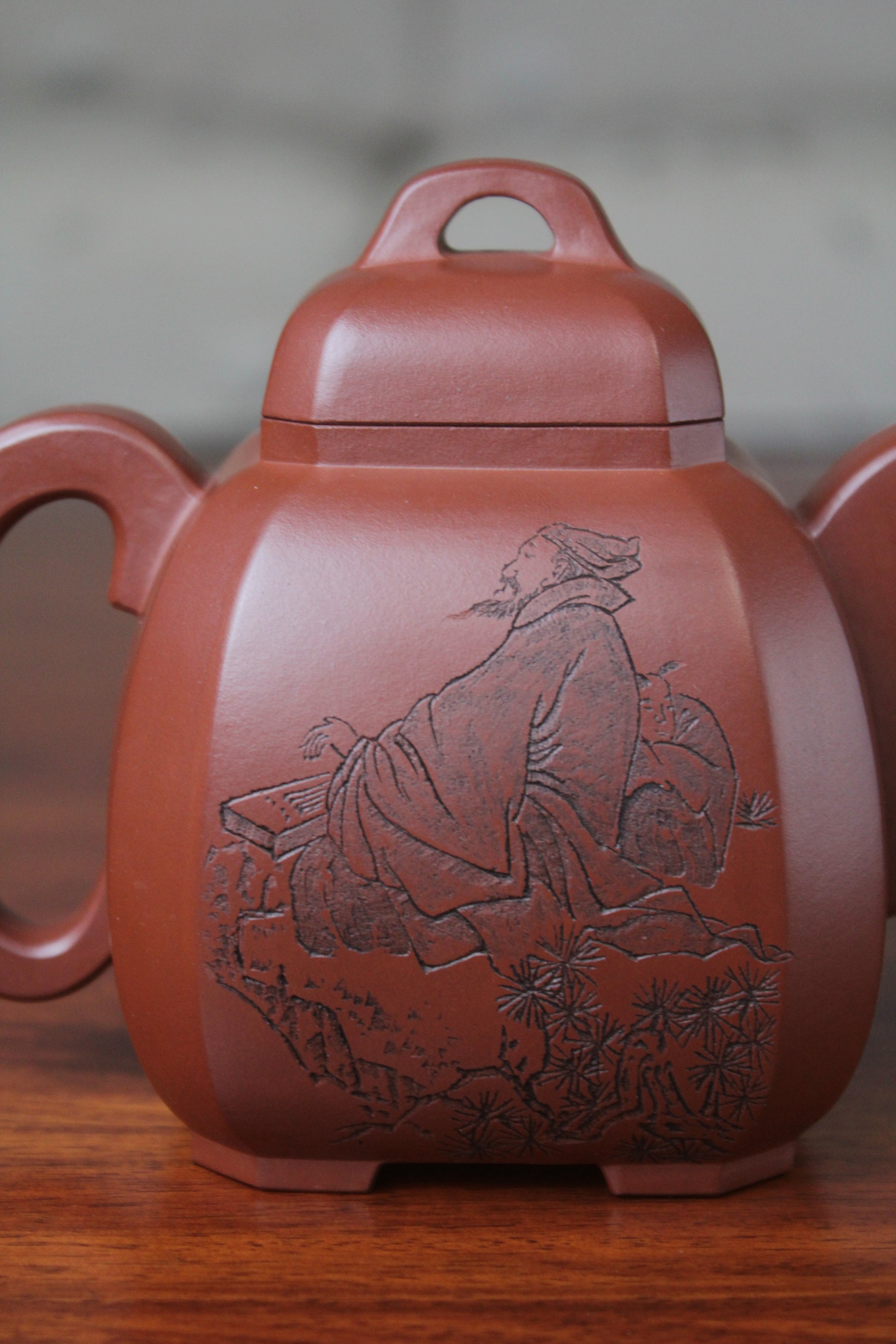 a pattern of the collectible teapot from teapot artist on the table