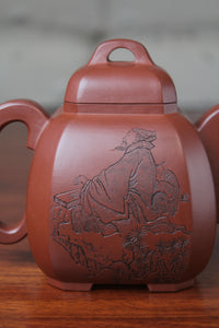 a pattern of the collectible teapot from teapot artist on the table