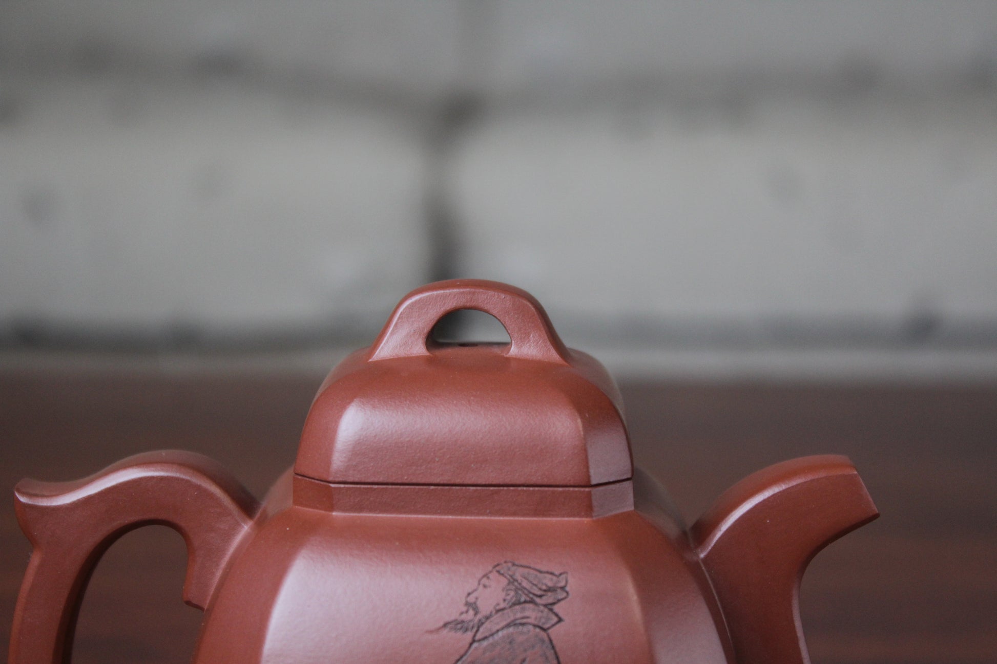 lid of the collectible teapot from teapot artist on the table