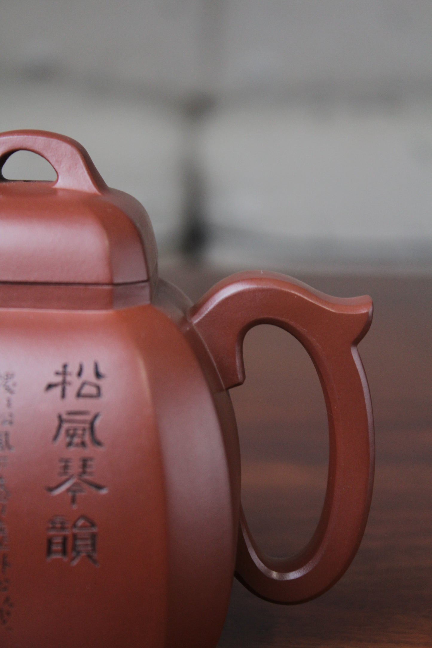 handle of the collectible teapot from teapot artist on the table