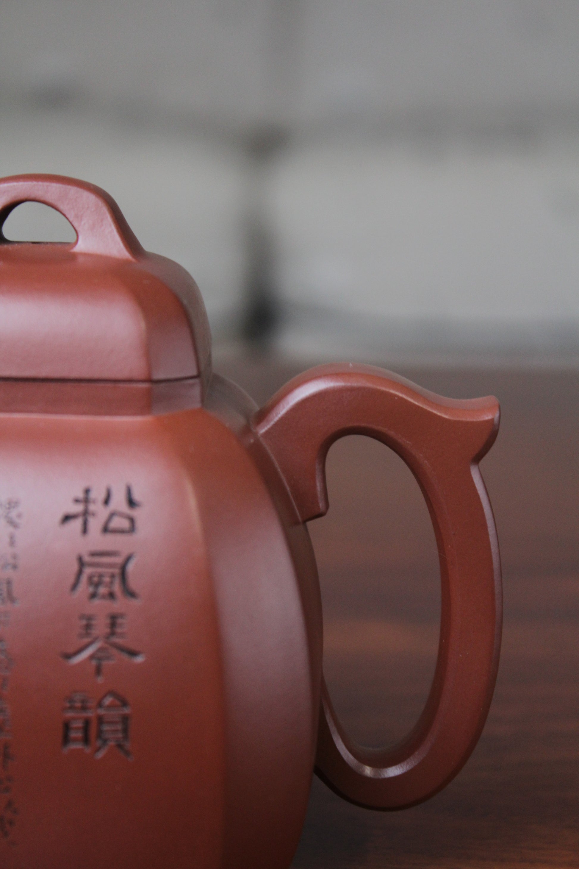 handle of the collectible teapot from teapot artist on the table